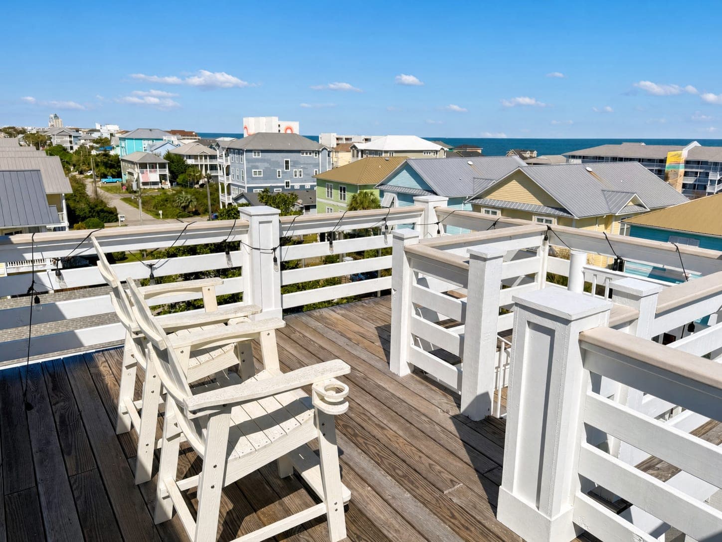 Enhanced rooftop deck photo with brighter sky, clearer deck, and stronger curb appeal